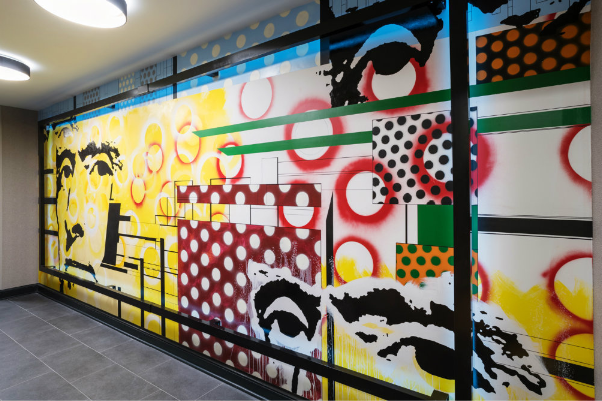a wall with colorful art on it