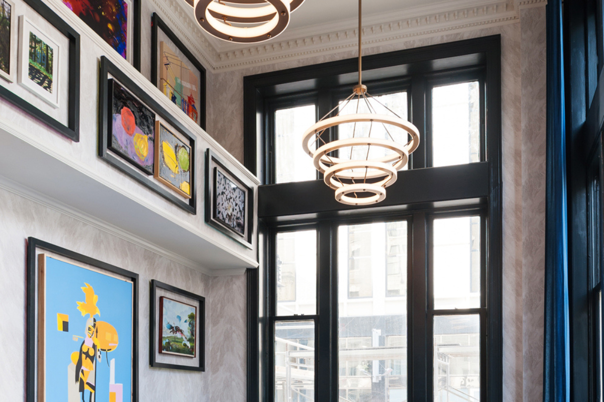 a room with a large window and art