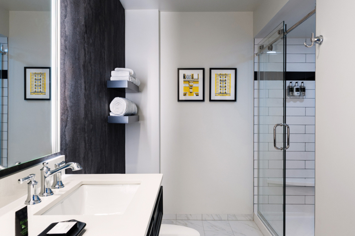 a bathroom with a shower and sink