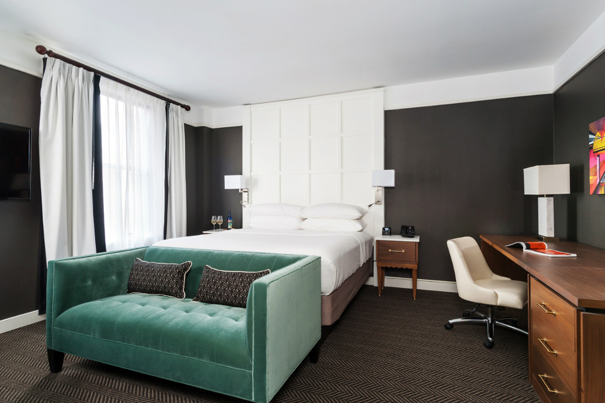 a room with a bed and a desk