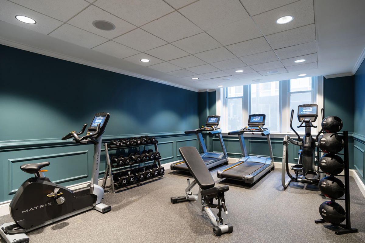 a room with treadmills and exercise equipment