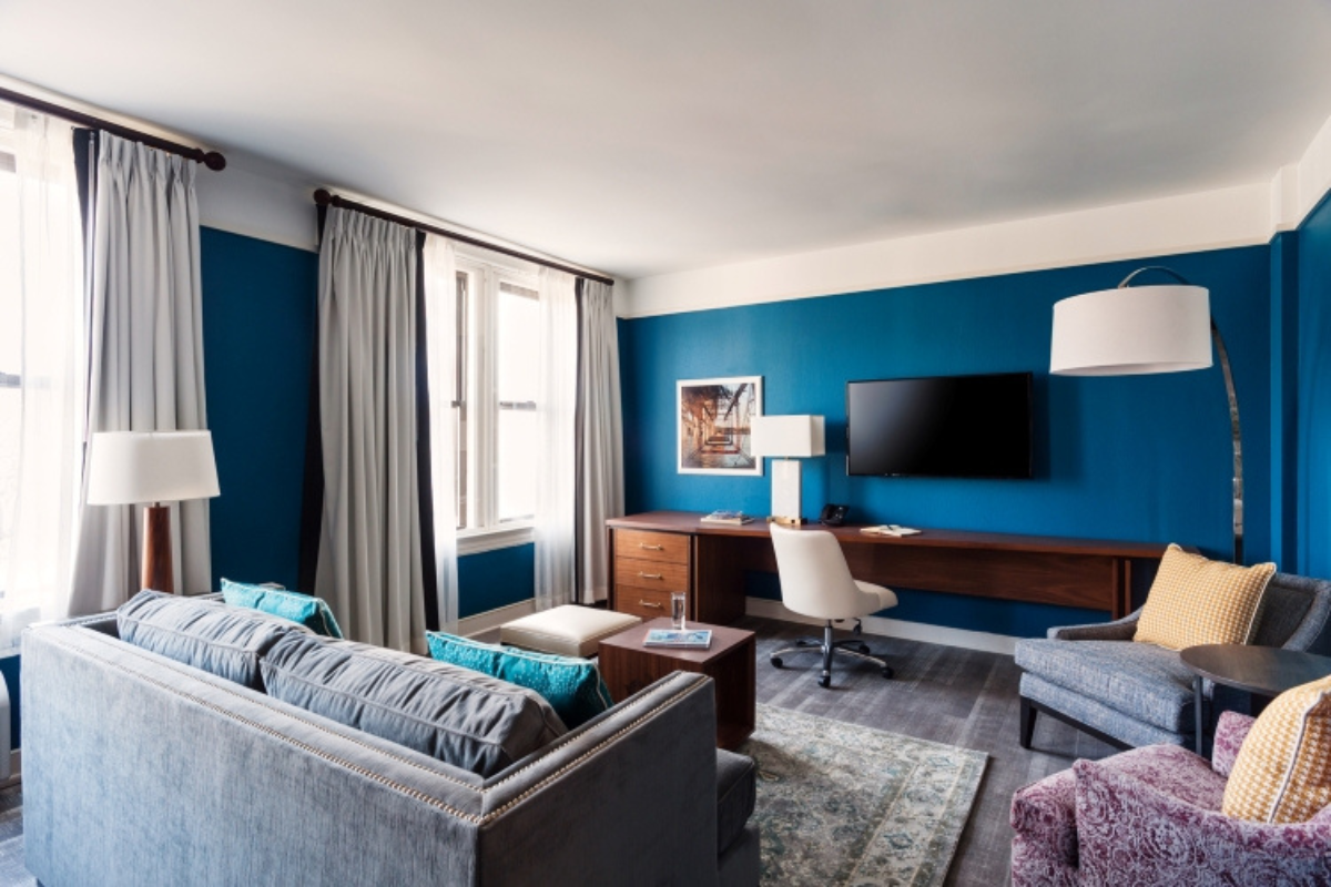 a room with a tv and couches
