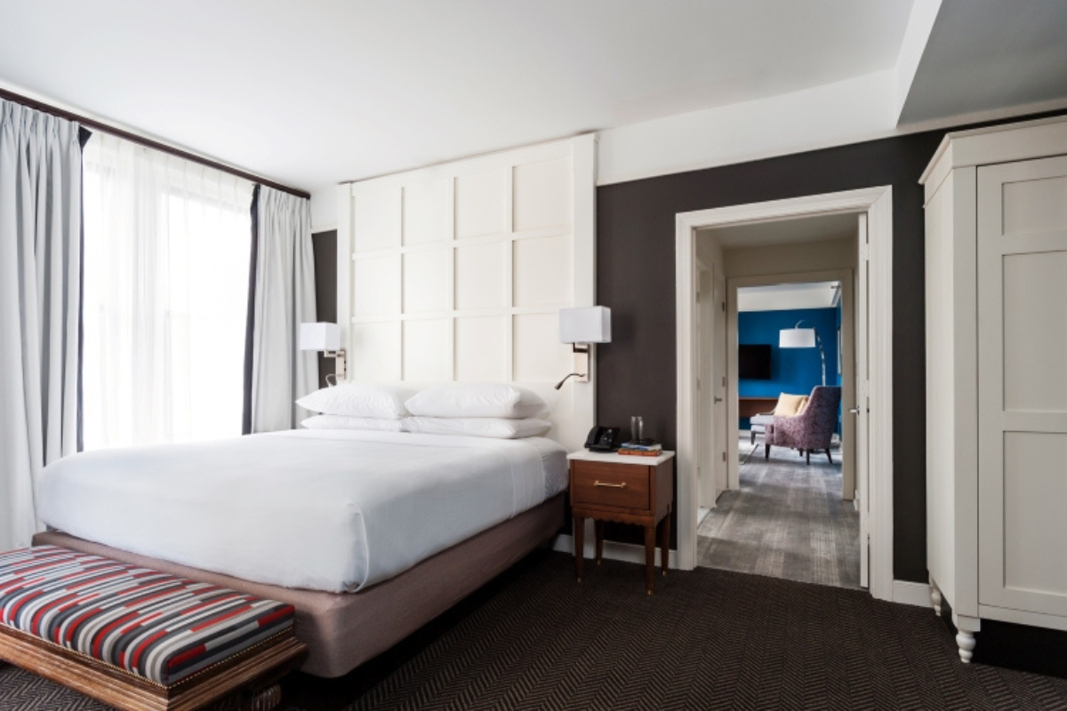 a bedroom with a bed and a table