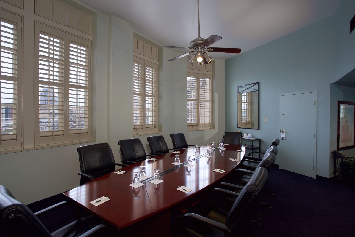 a conference room with a table and chairs