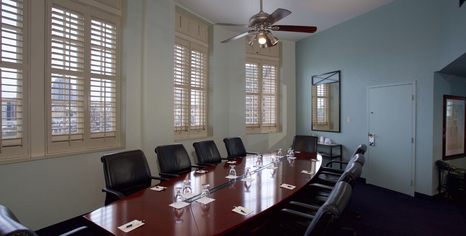 a conference room with a table and chairs
