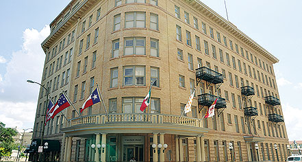 a building with flags on the front