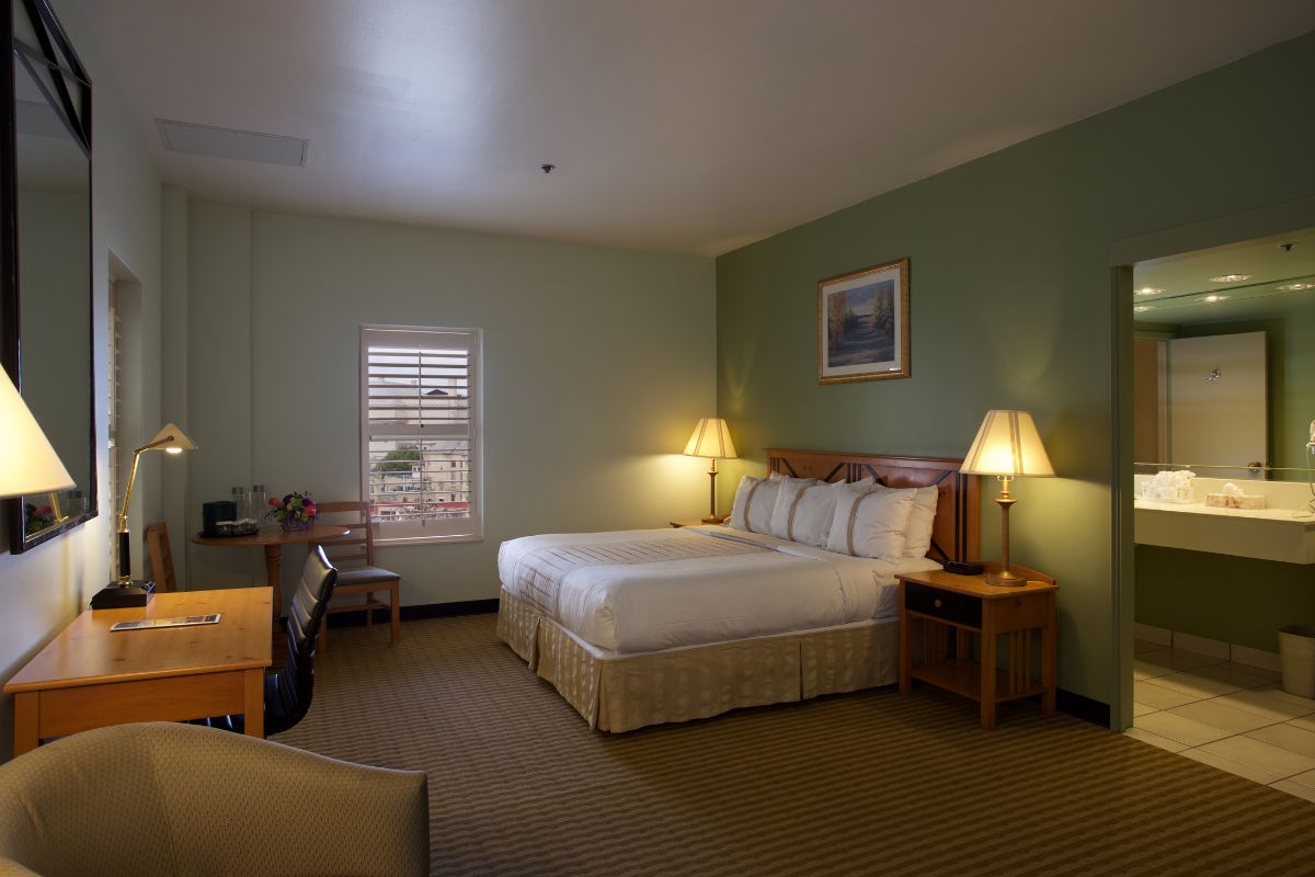 a hotel room with a bed and a table