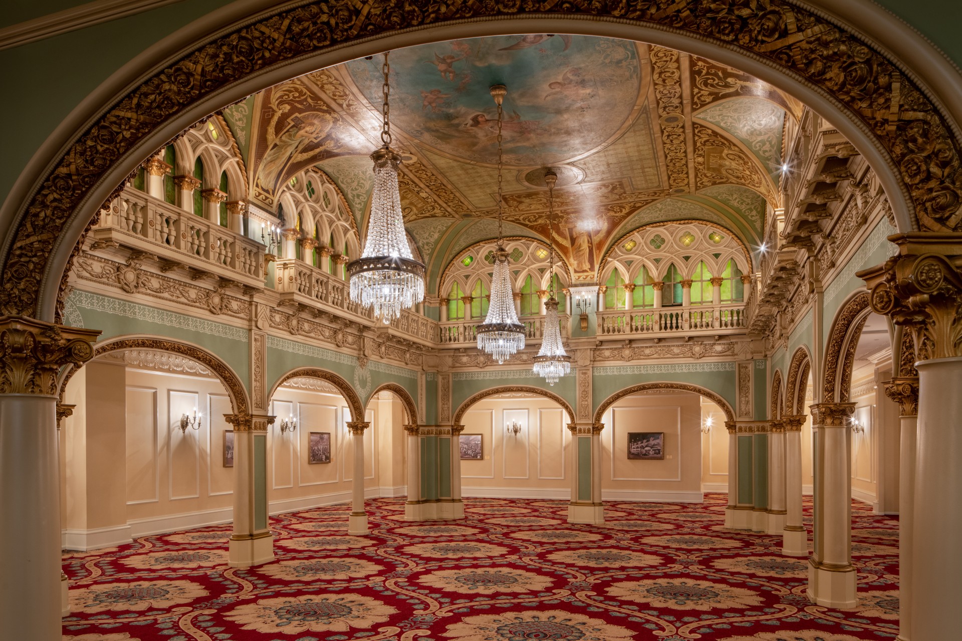 a large ornate room with chandeliers