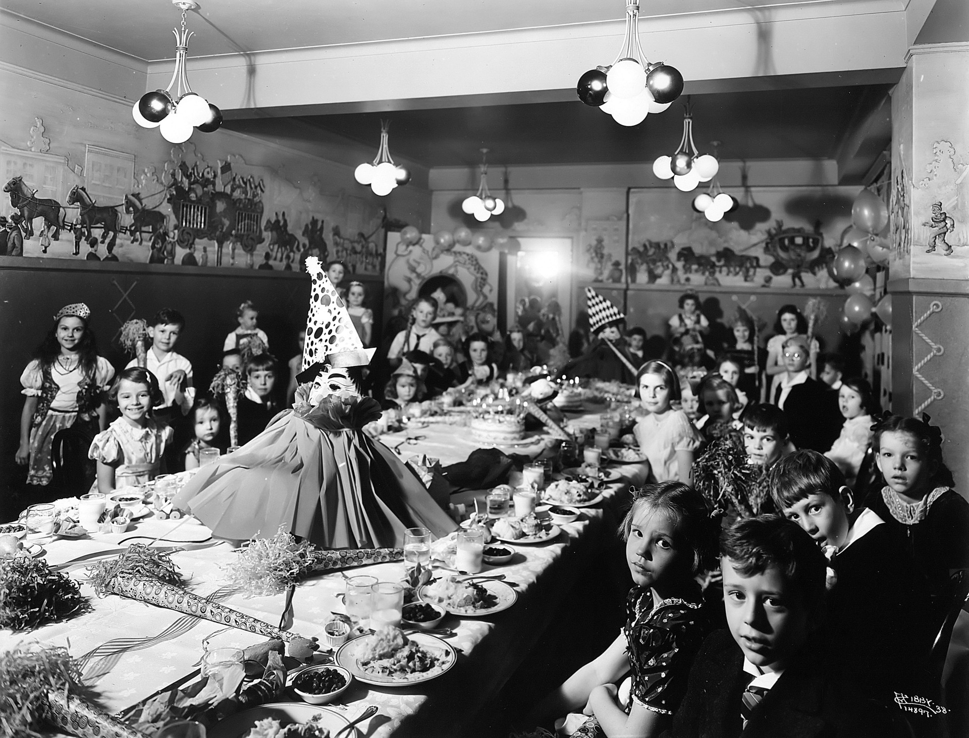 a group of children sitting at a table