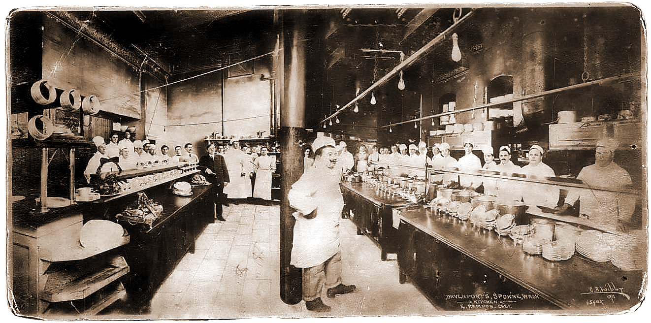 a group of people in a kitchen