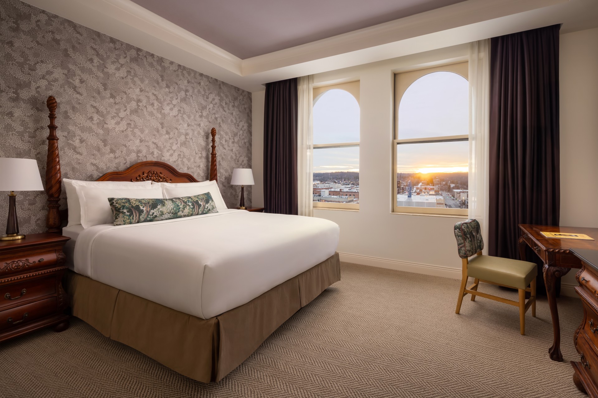 a bedroom with a bed and a chair