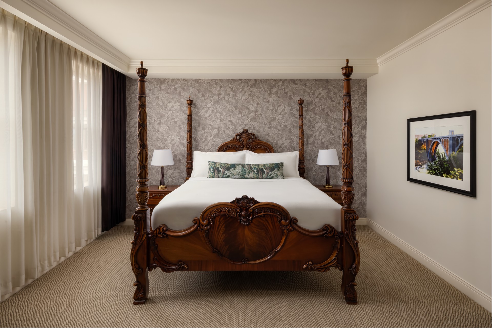 a bed with a four poster bed