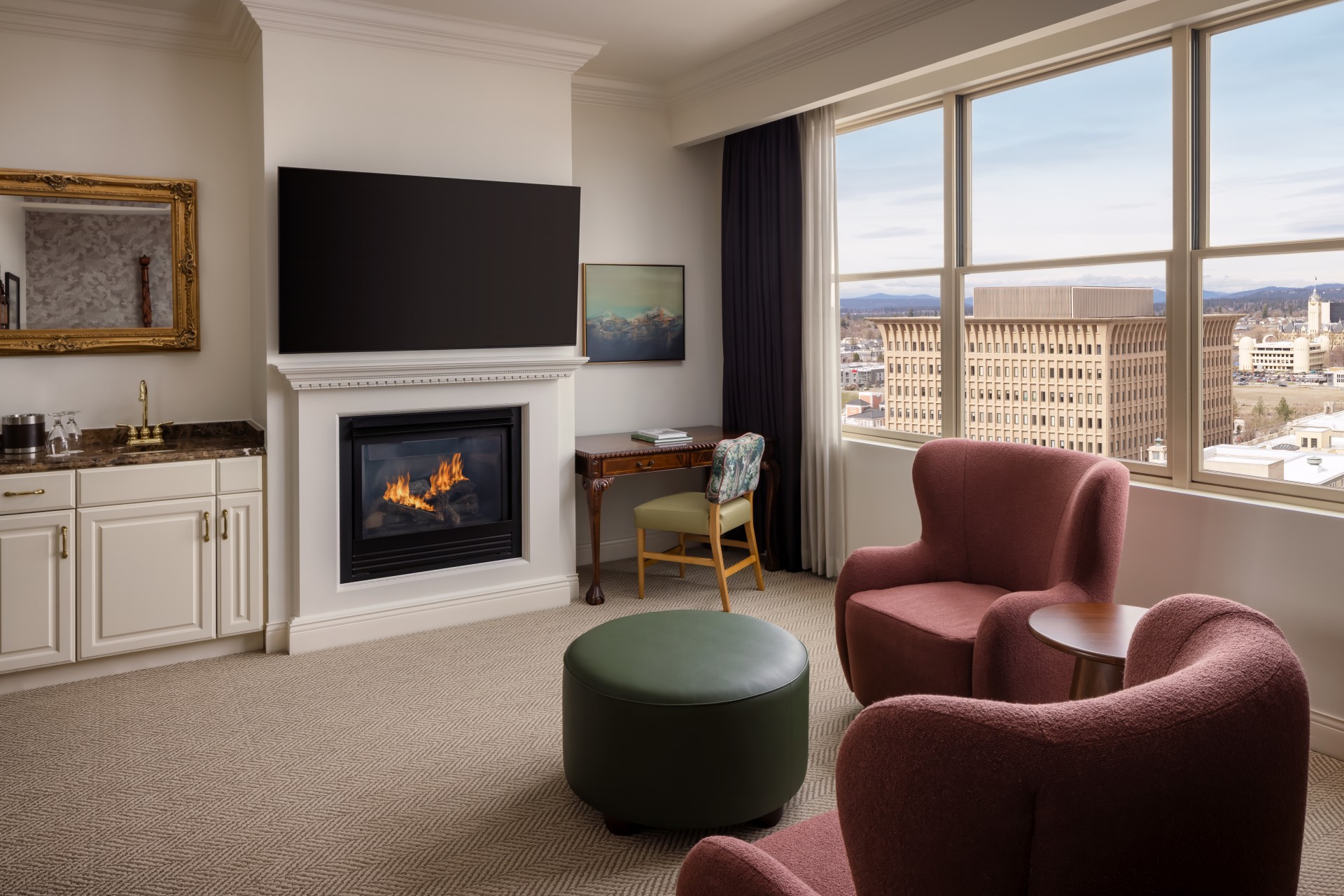 a room with a fireplace and chairs
