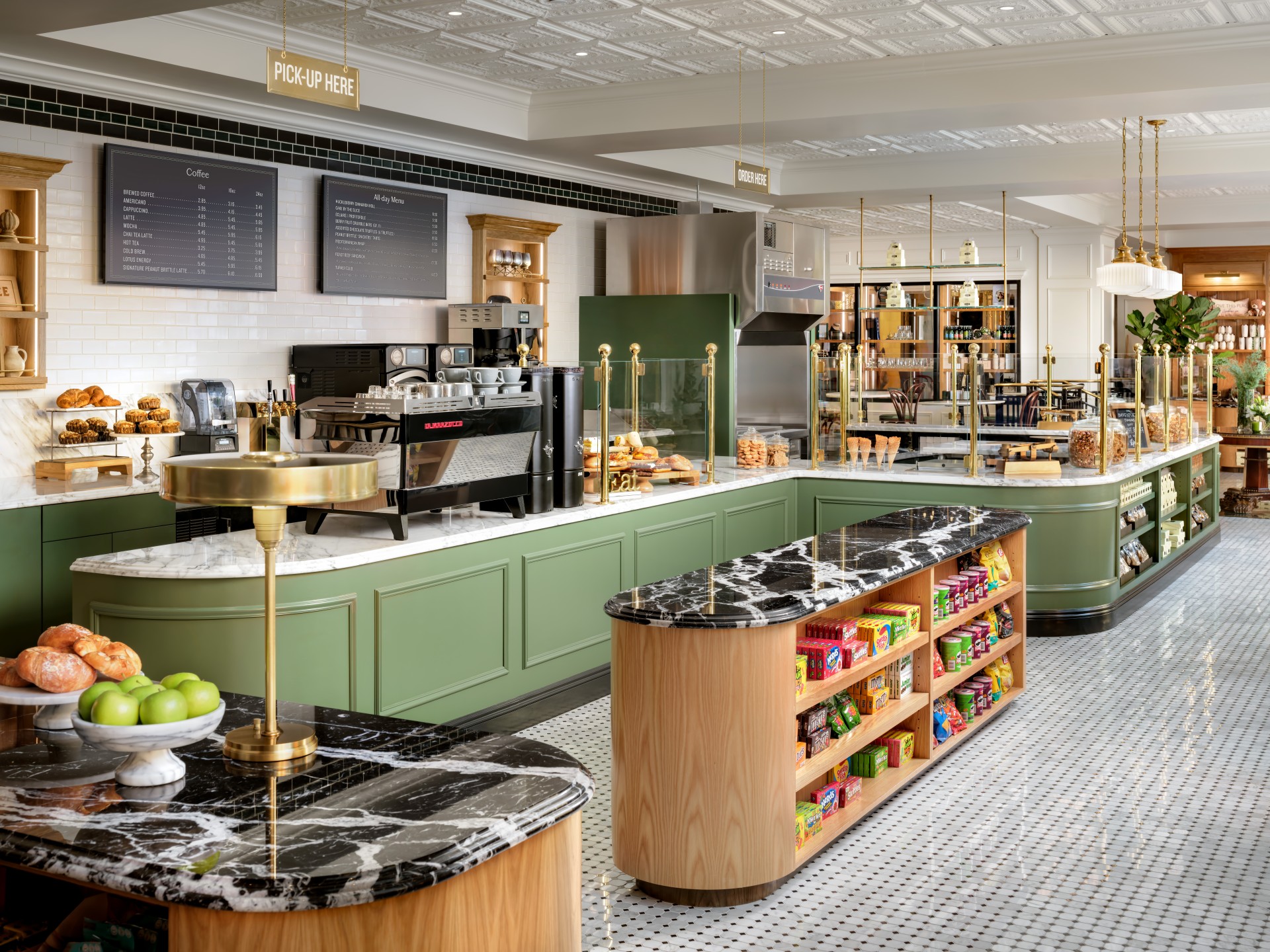 a large kitchen with green counter tops and black marble counter tops