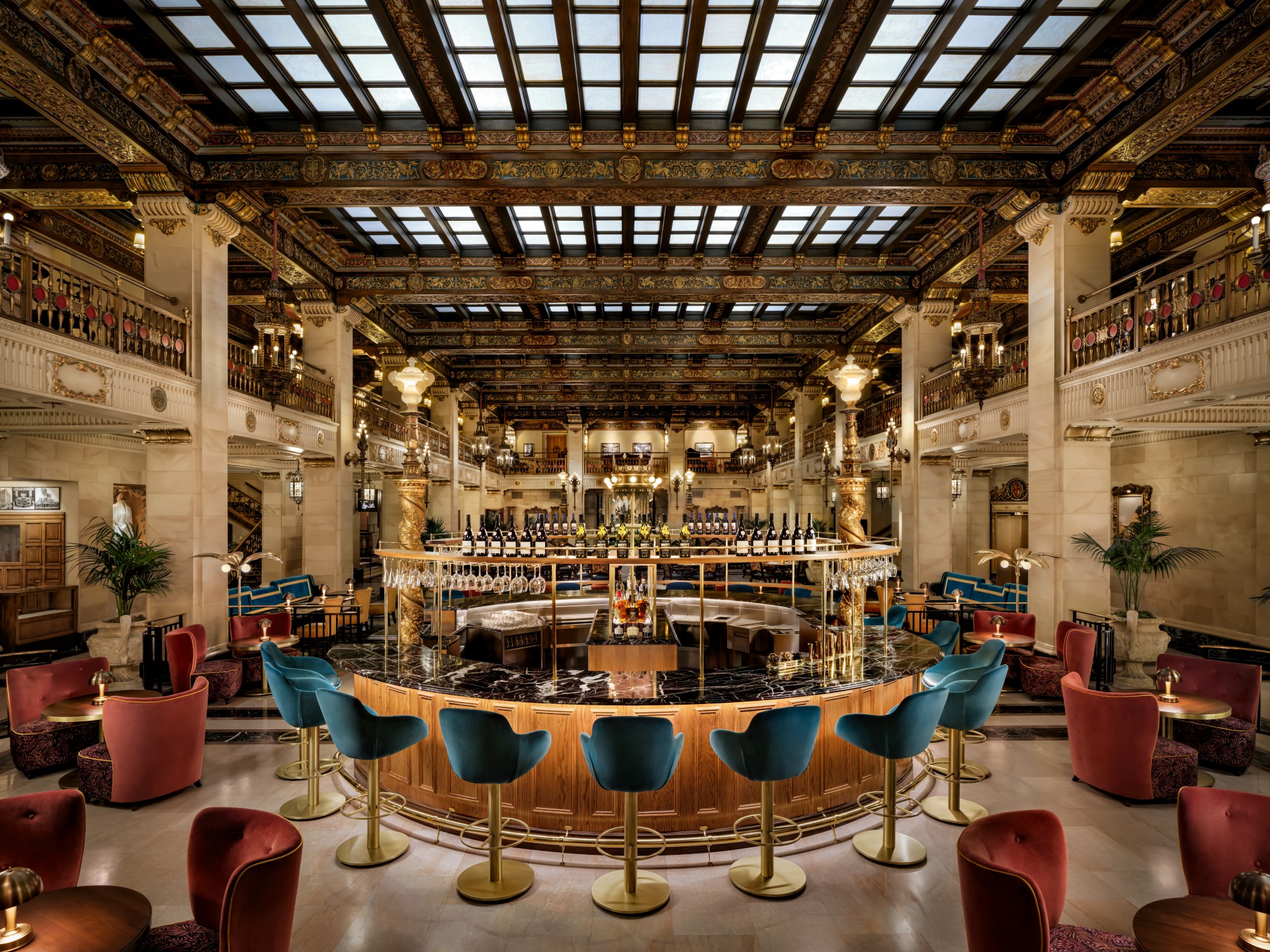 a room with a bar and chairs