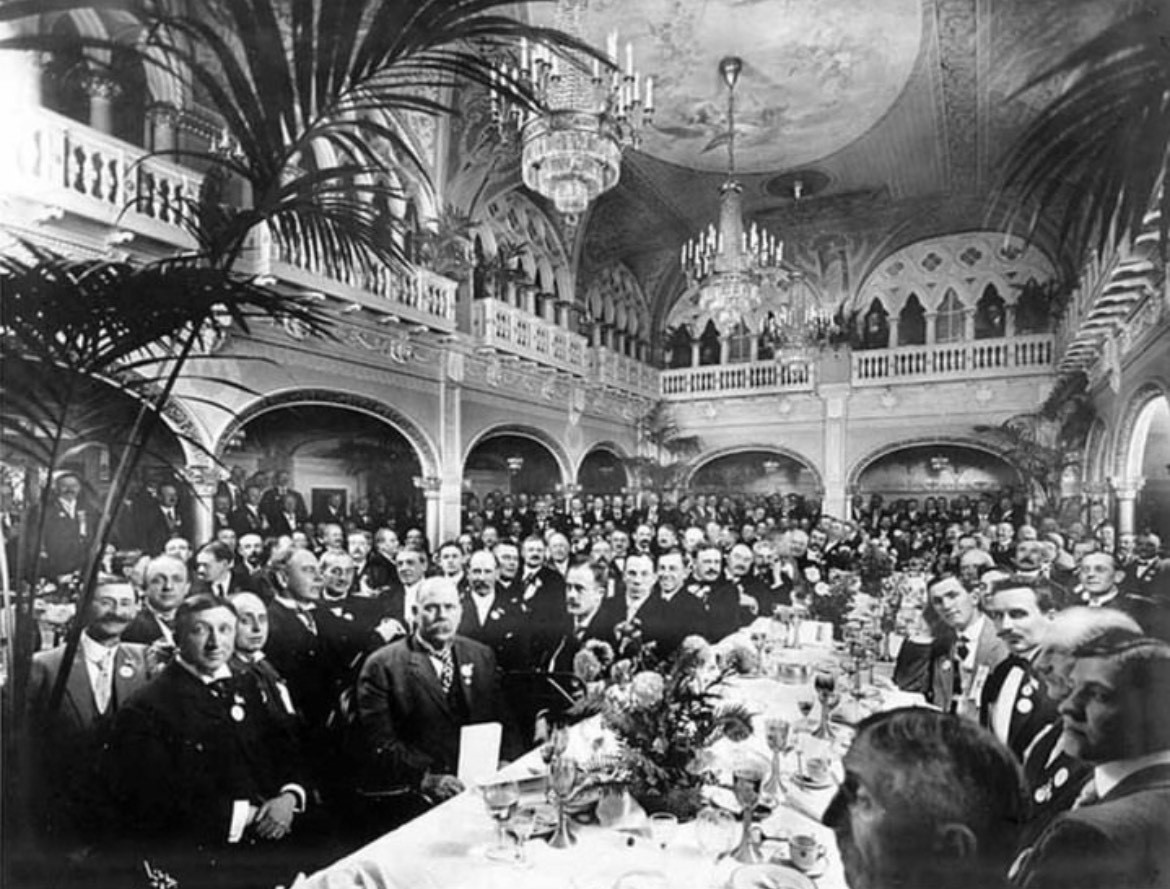 a large group of people sitting at a table