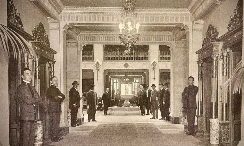 a group of men standing in a hallway