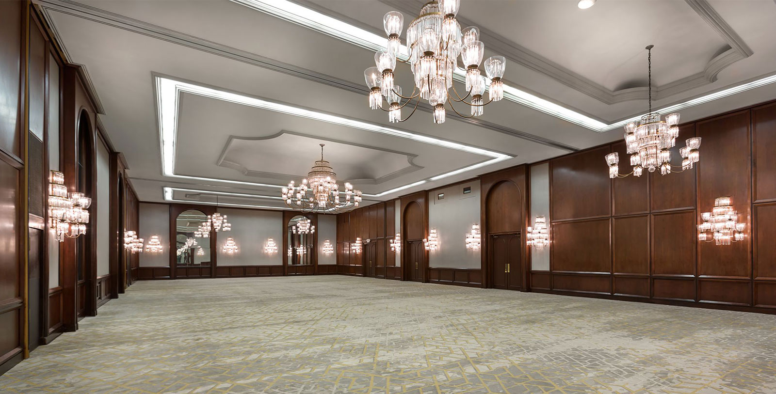 a large room with chandeliers and mirrors