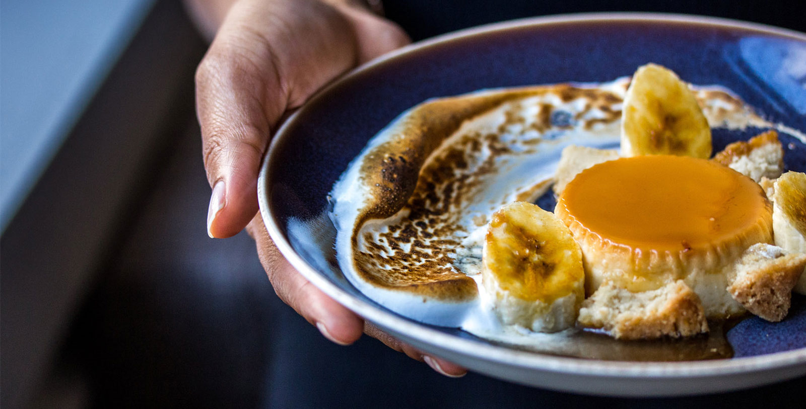 a person holding a plate of food