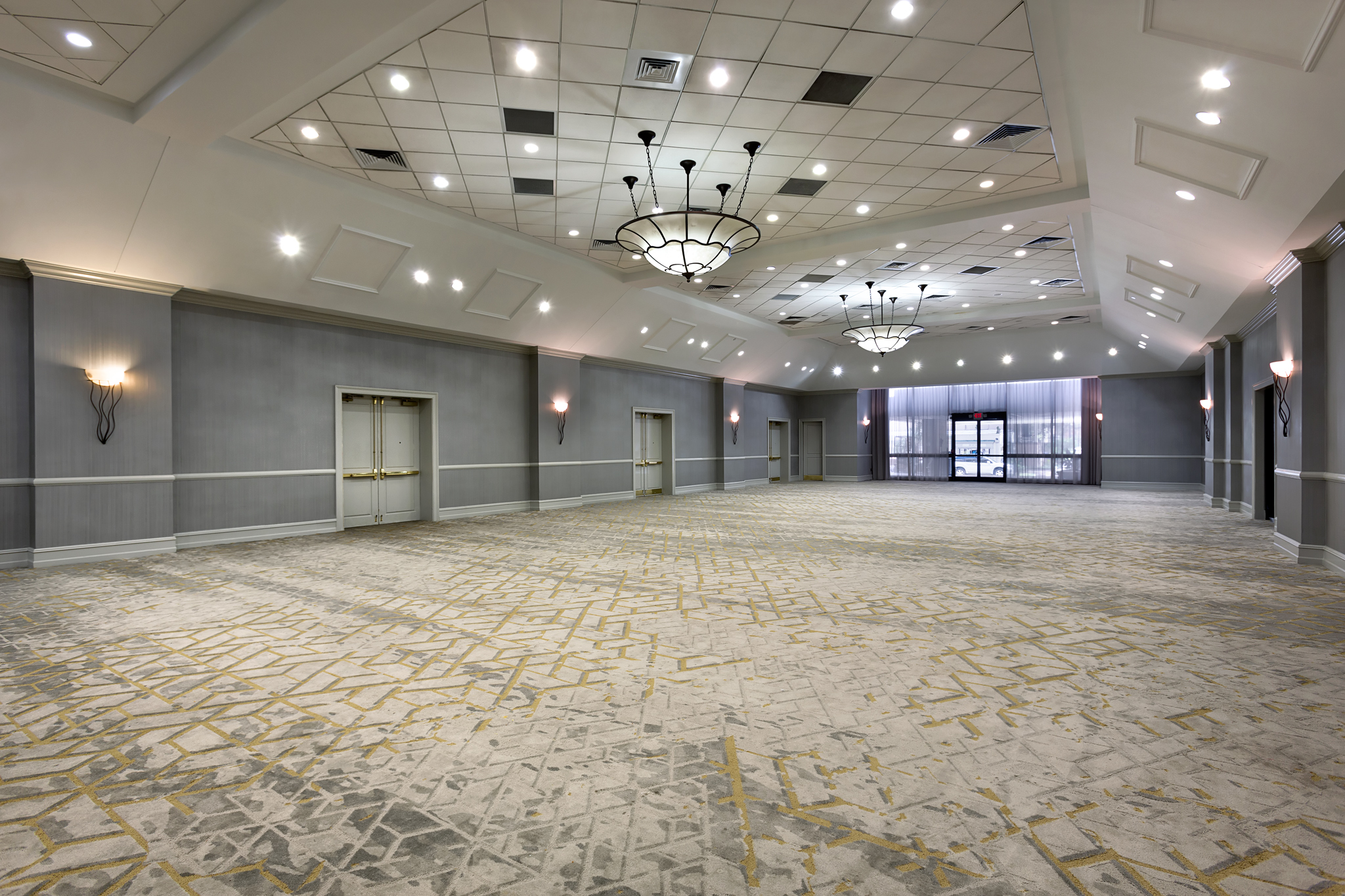 a large room with lights and doors