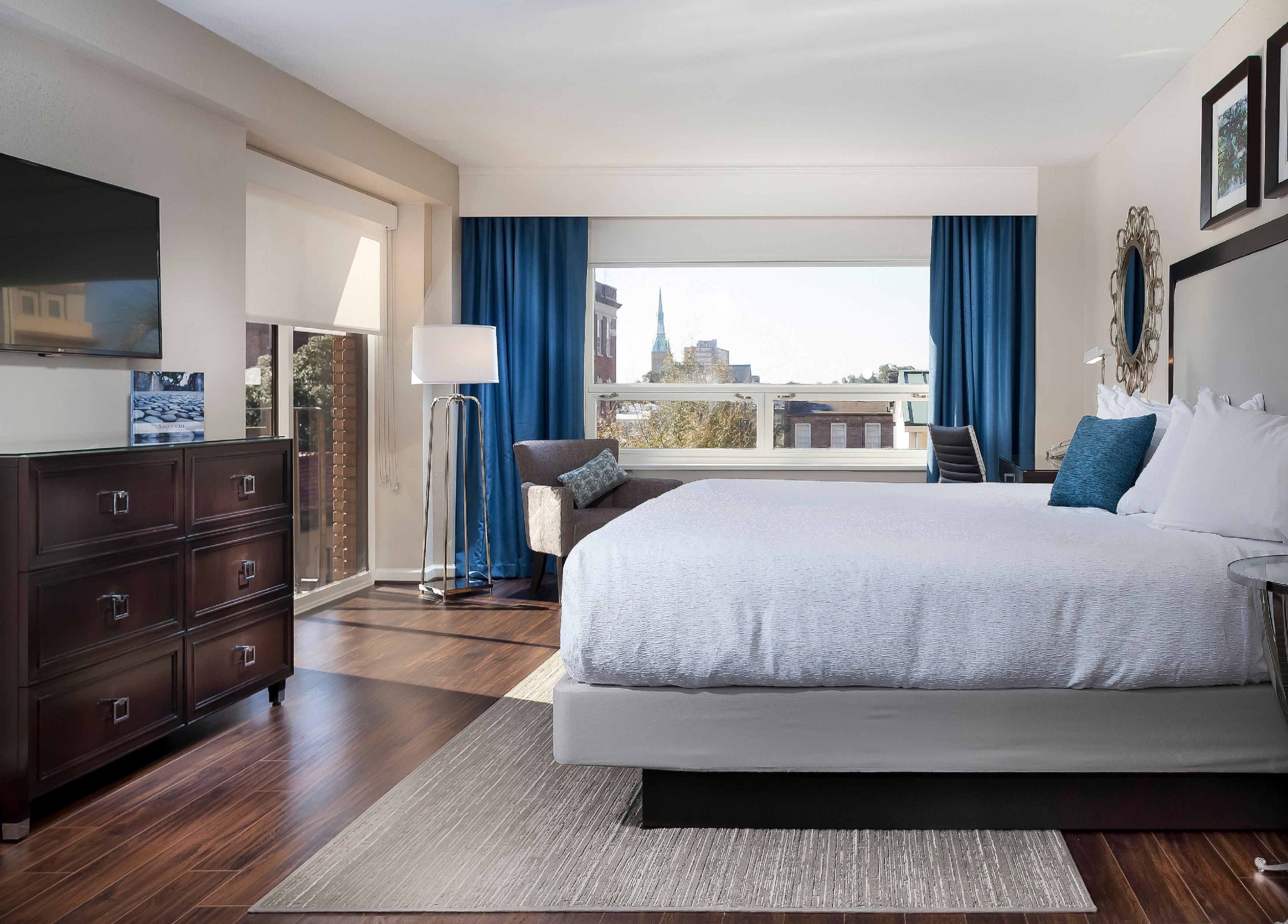 a bedroom with a bed and a dresser