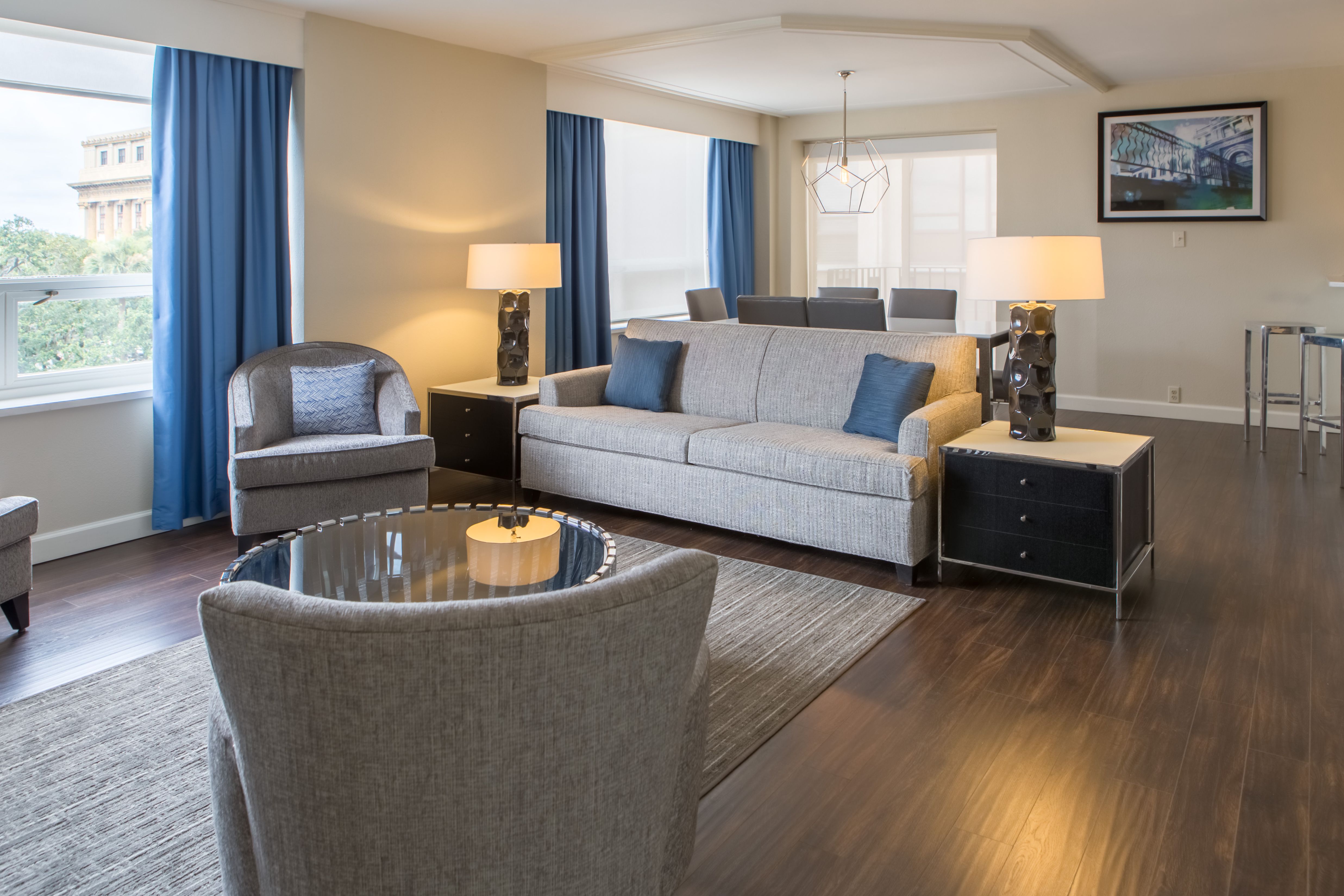 a living room with couches and chairs