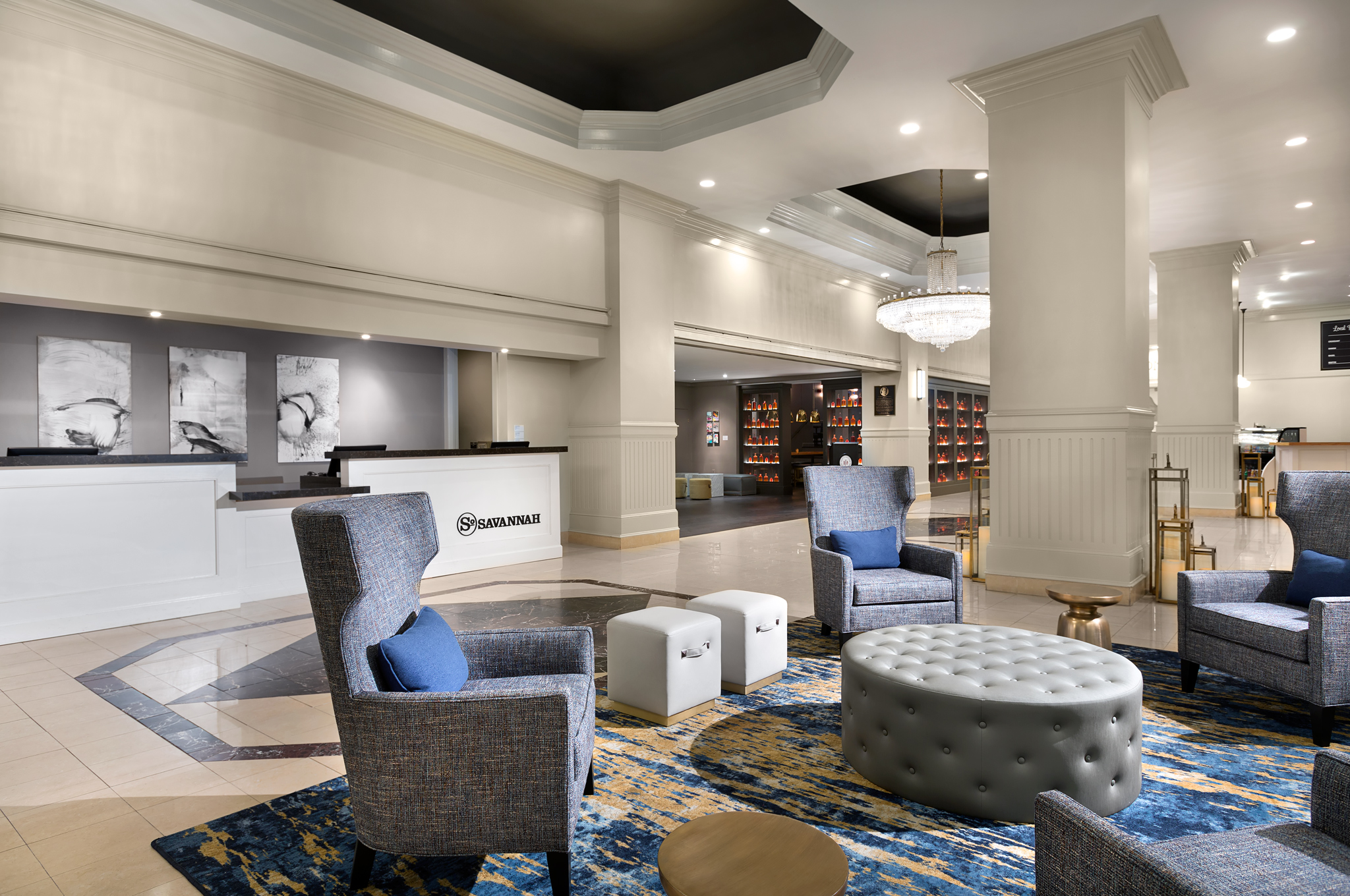 a lobby with chairs and a table