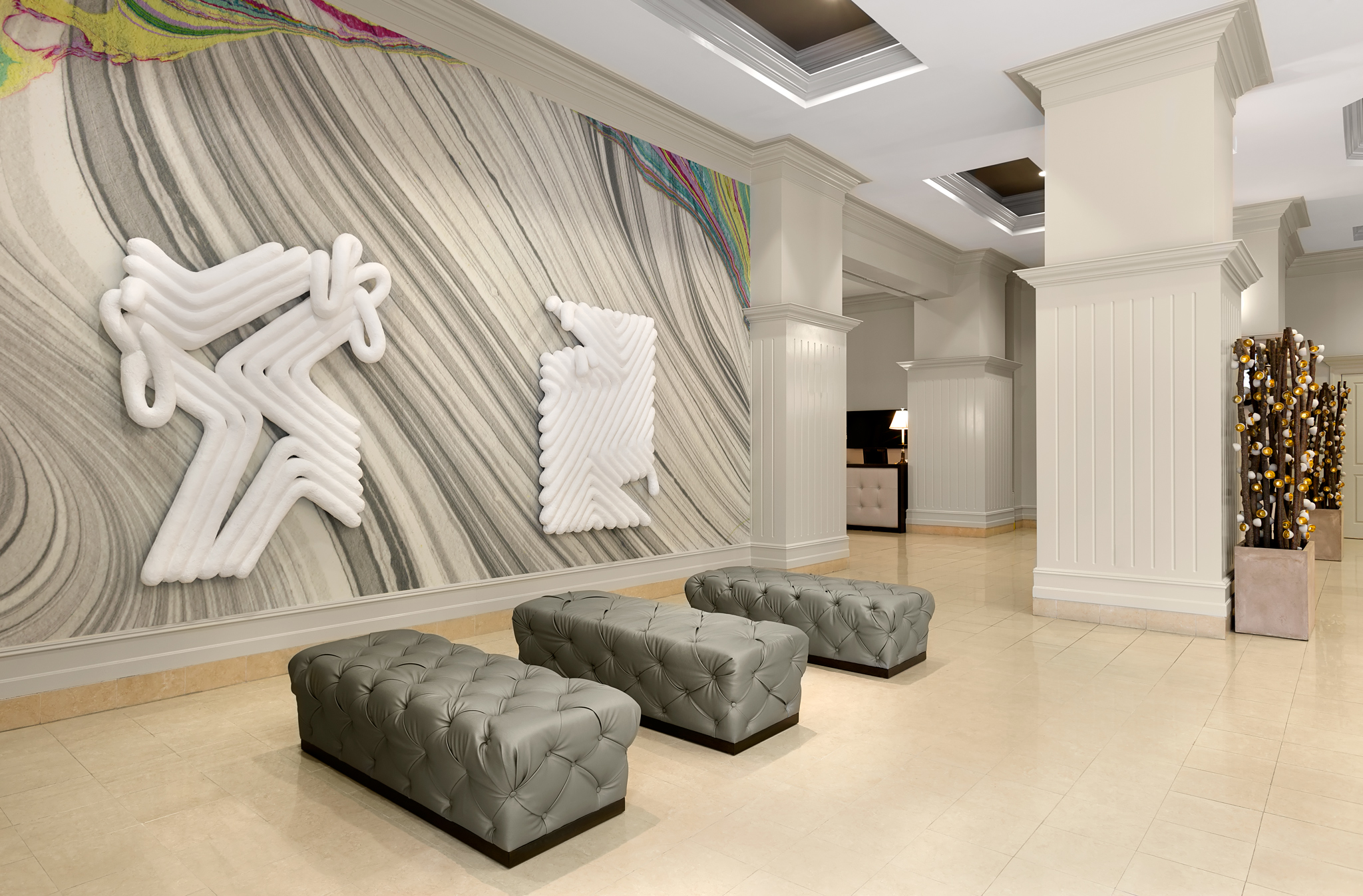a room with a wall and chairs