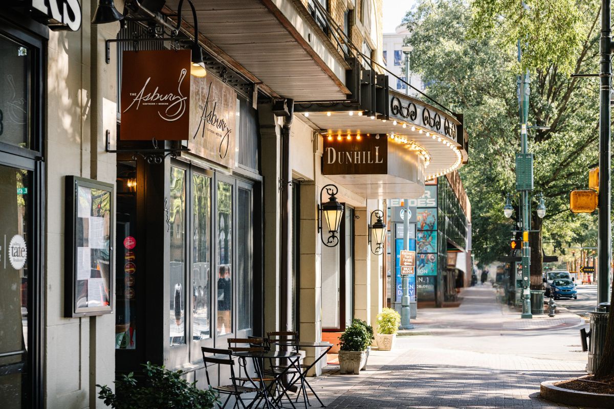 a street with shops and tables