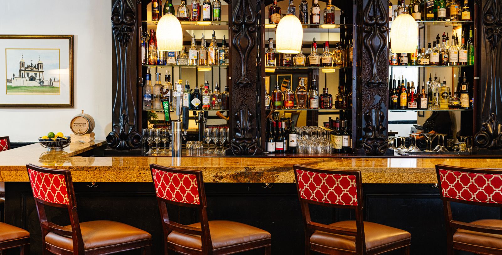 a bar with bottles and glasses