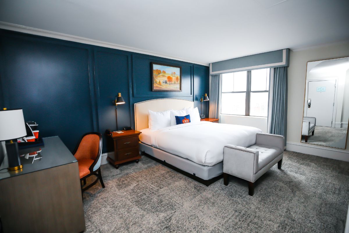 a room with a bed and chair