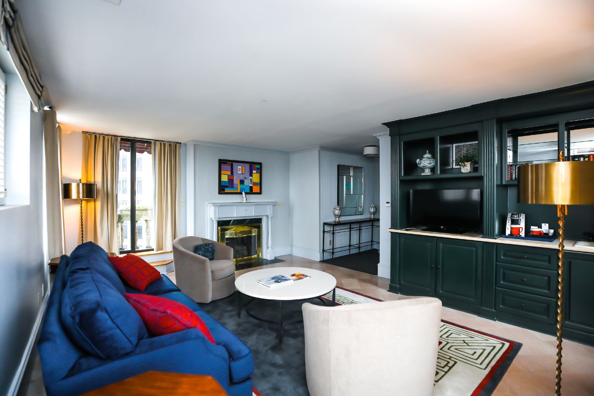 a living room with a fireplace and couches