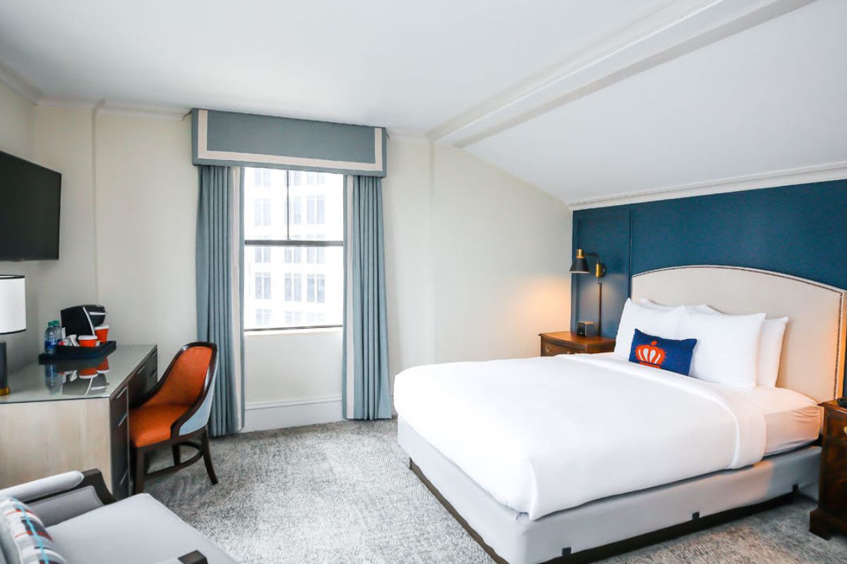 a room with a bed and a desk