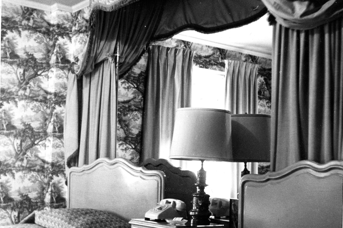 a lamp on a table in a bedroom