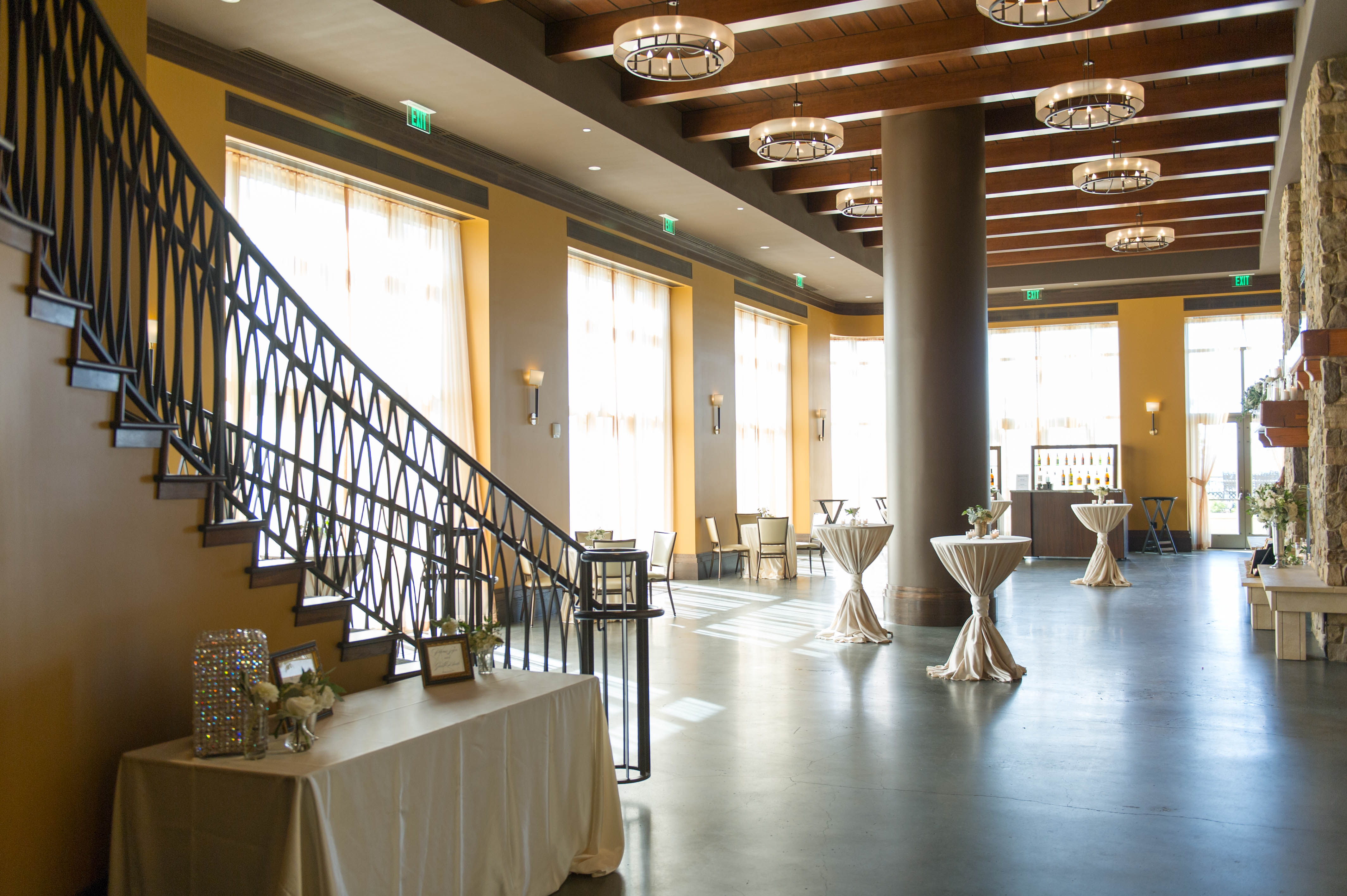 a room with tables and stairs