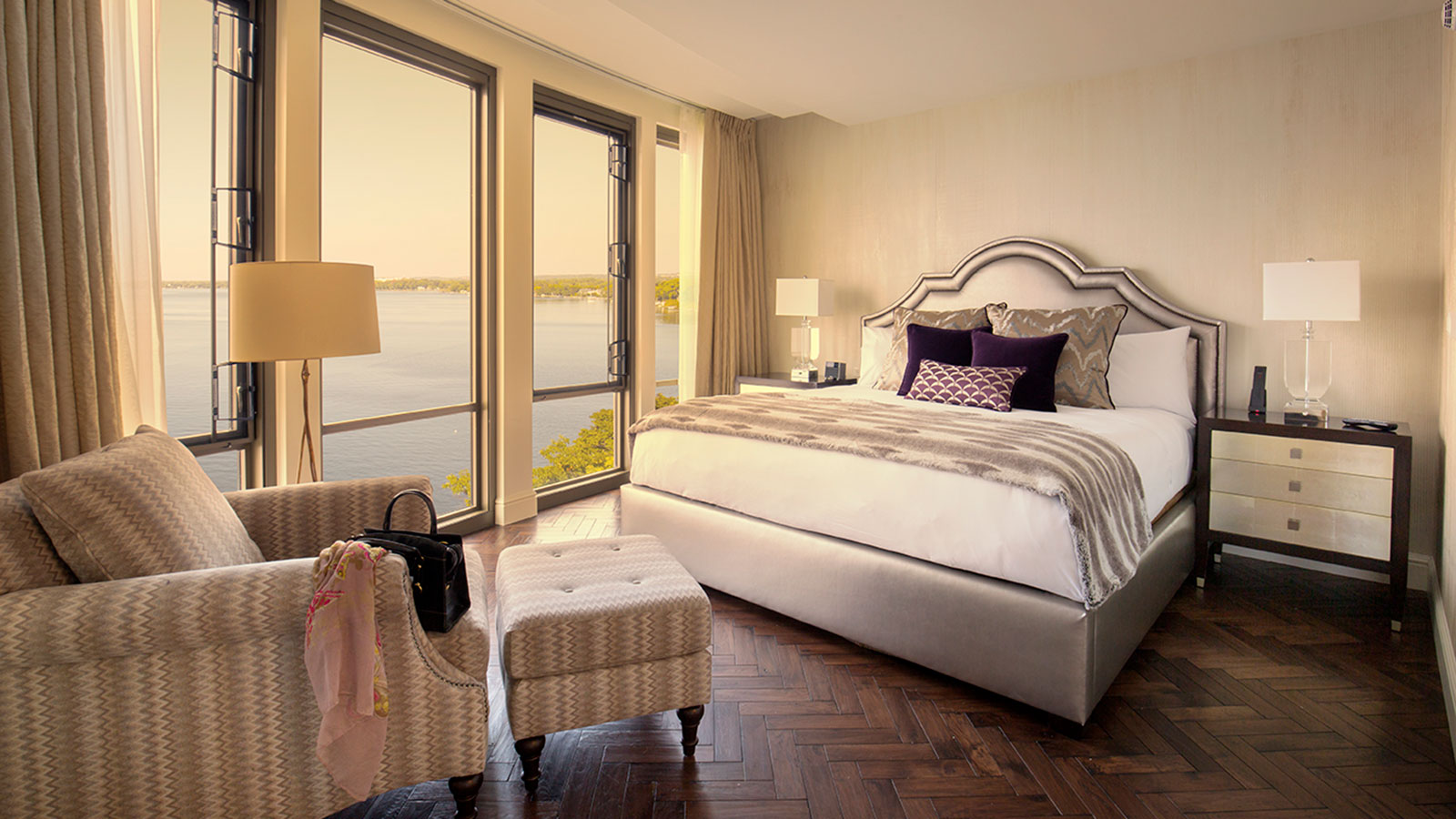 a bedroom with a large bed and a large window