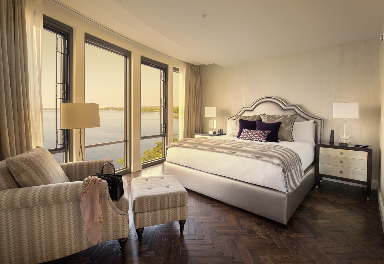 a bedroom with a large bed and a large window