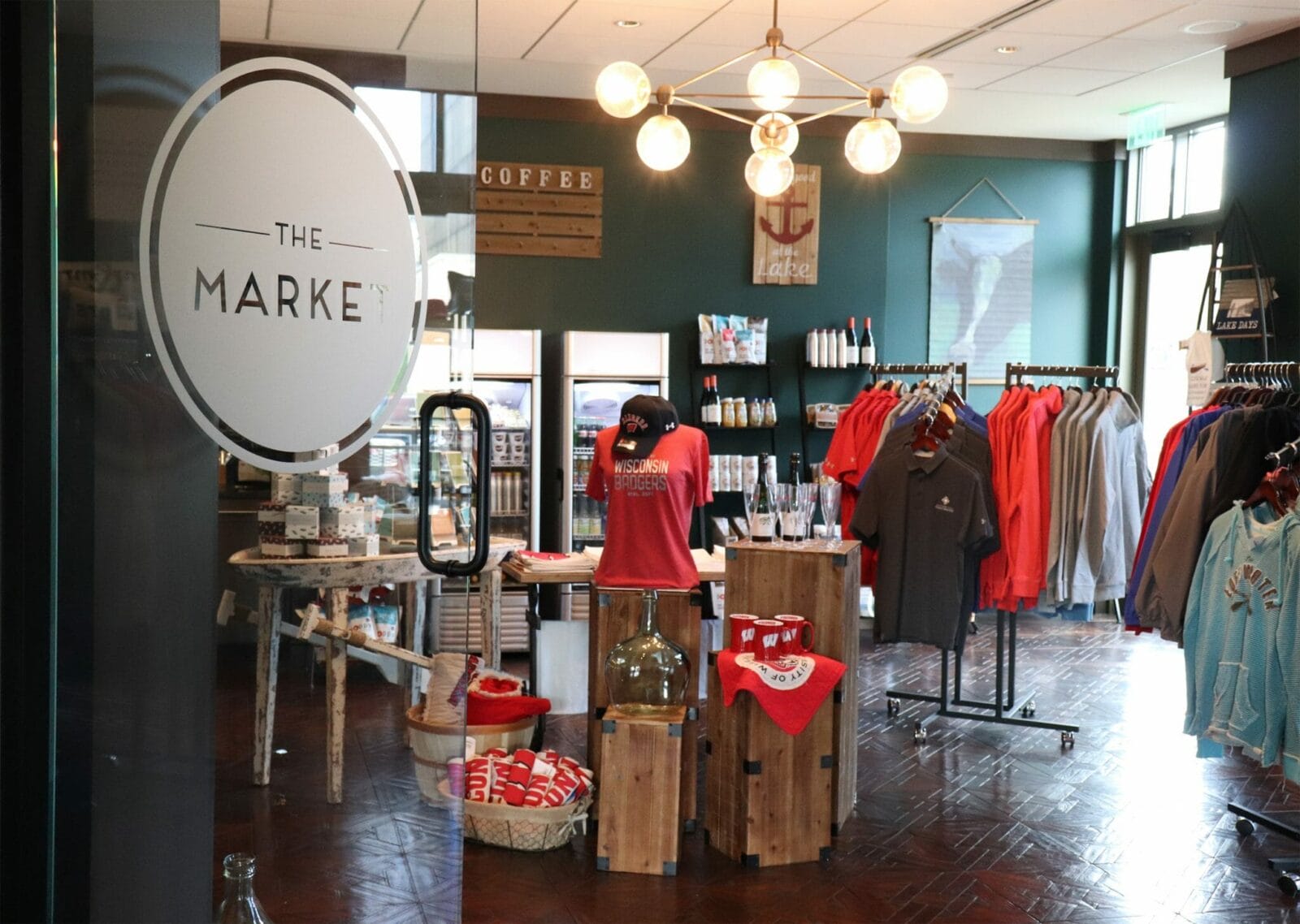 a store with a sign and clothes on display