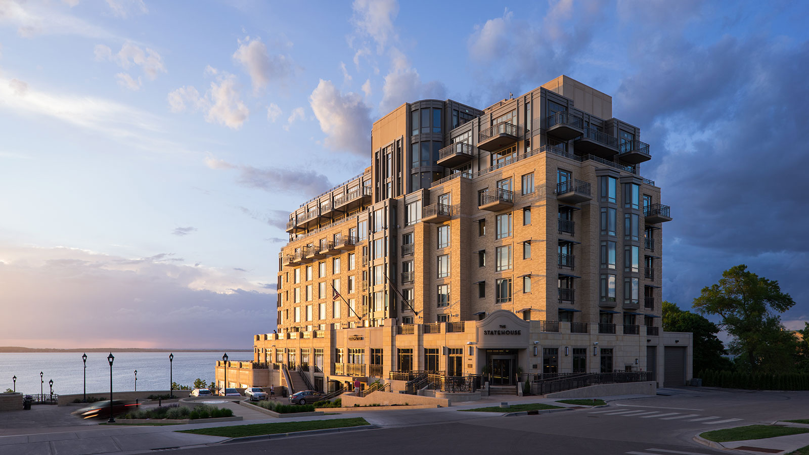 a building with a body of water in the background