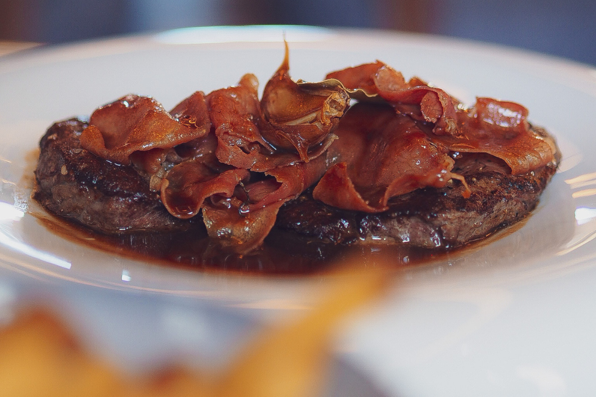 a plate of meat with sauce
