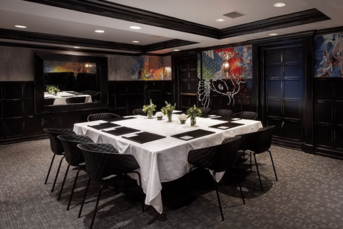 a room with a table and chairs