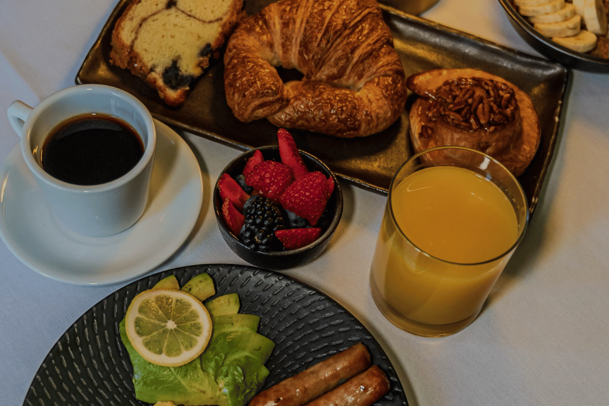 a plate of food and a drink on a table