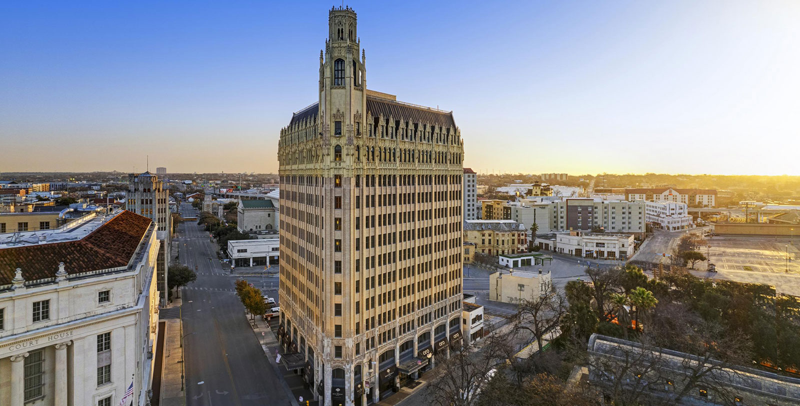 a tall building with a tall tower on the side of it