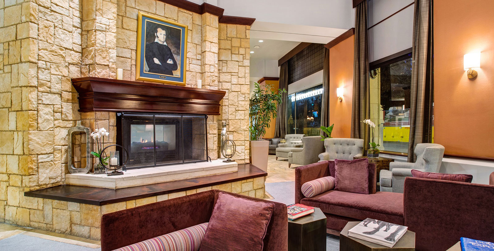 a room with a fireplace and couches