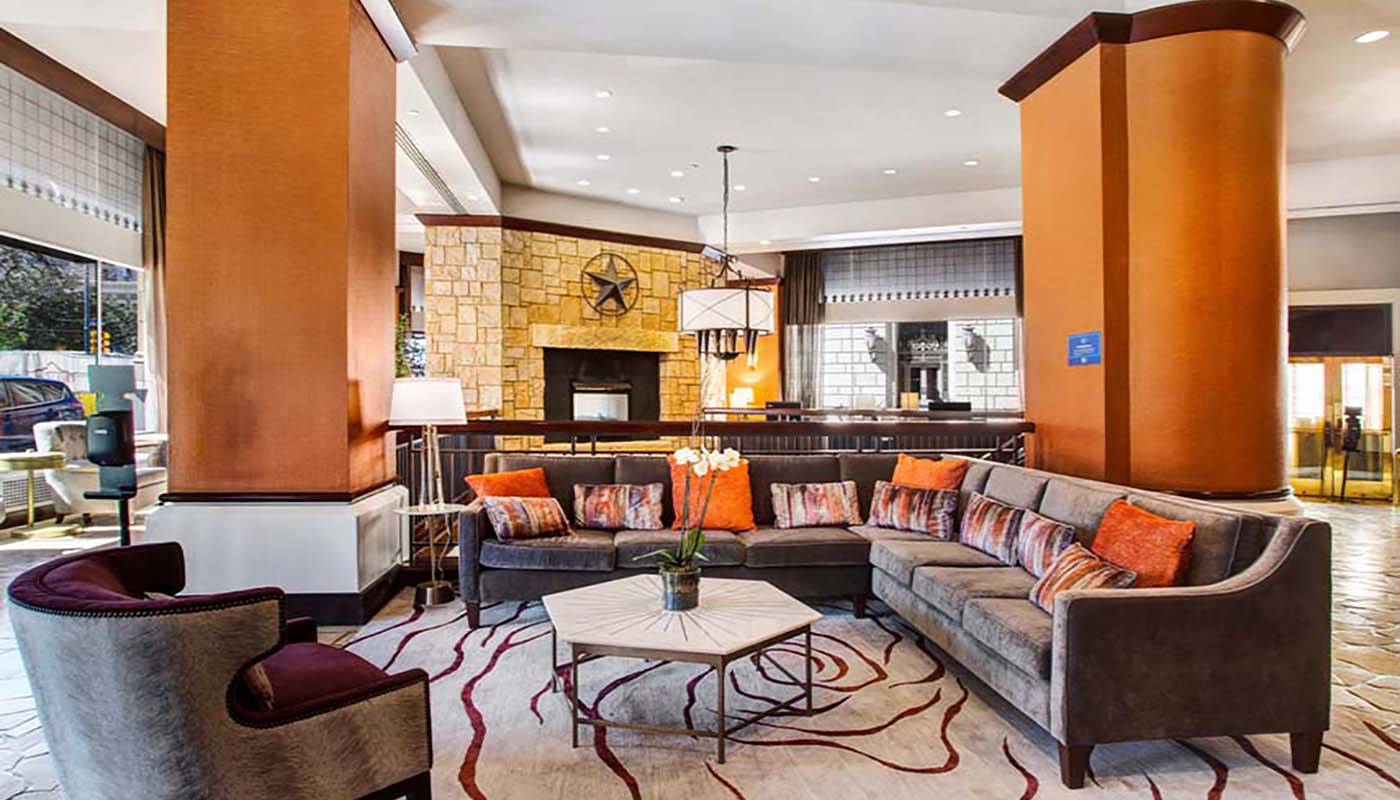 a living room with a couch and a fireplace