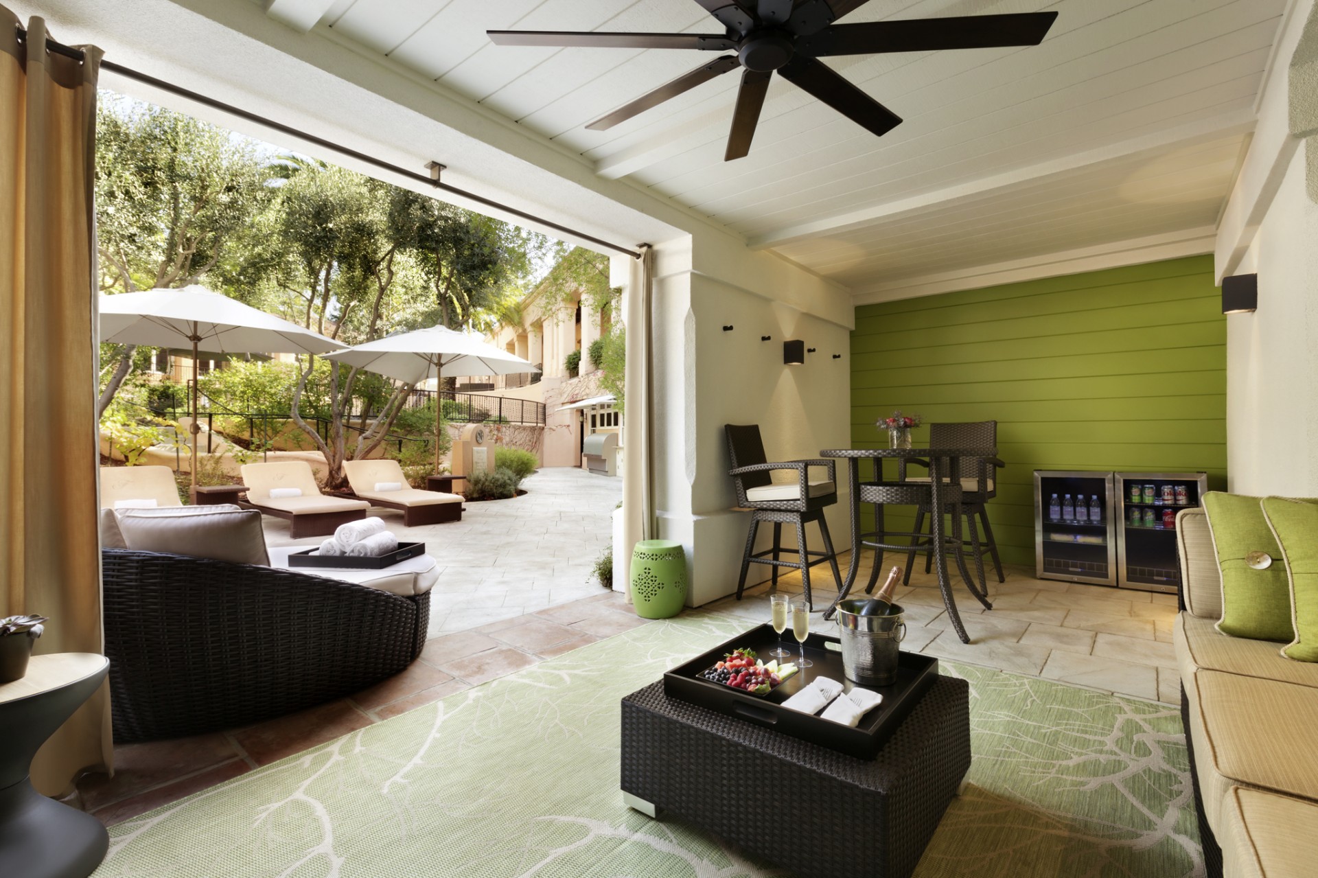 a patio with a table and chairs