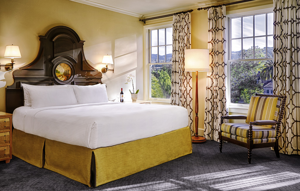 a room with a bed and a chair