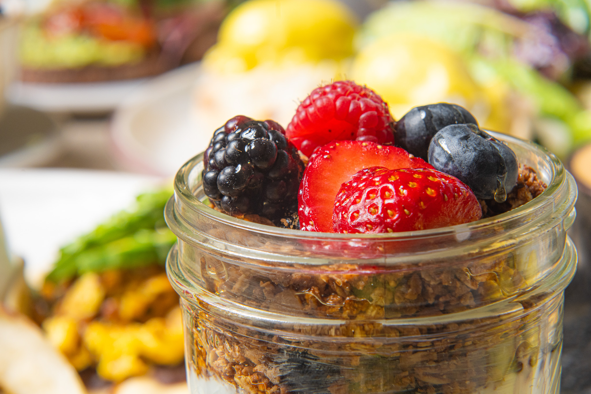 a jar of fruit in a bowl