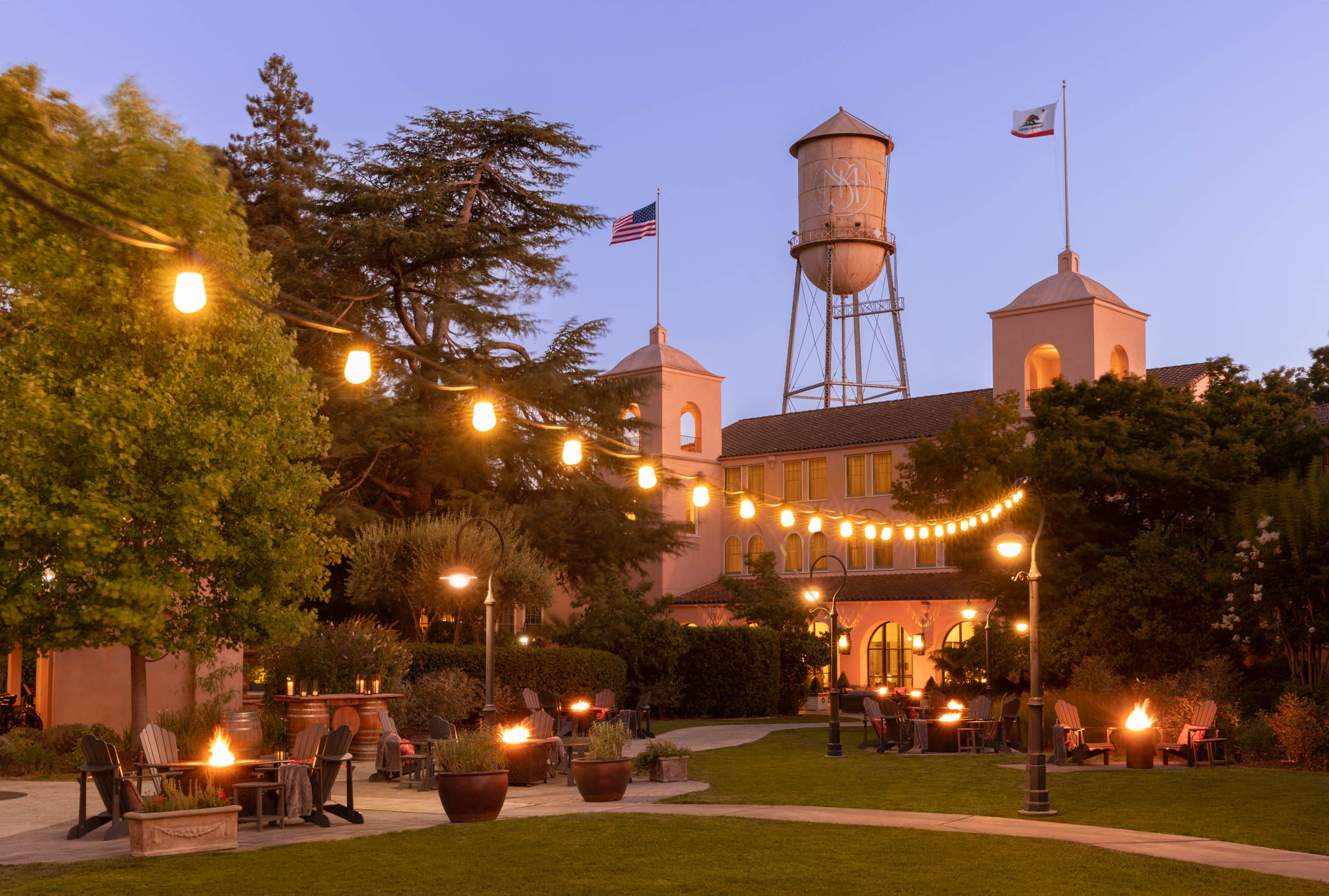a building with a water tower and a flag