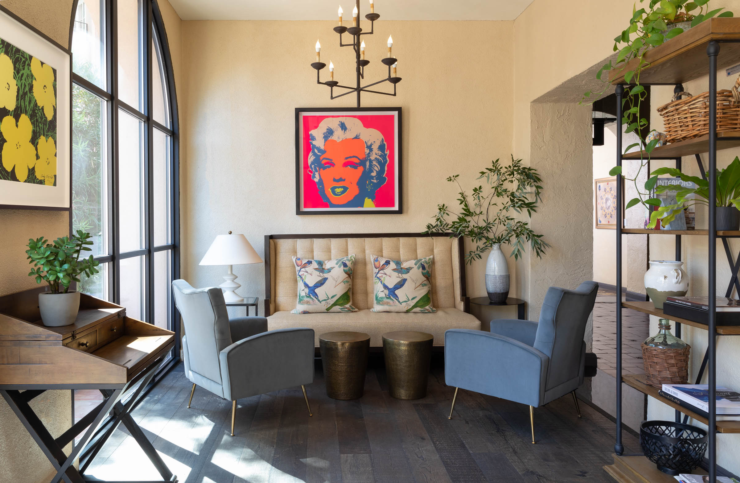 a room with a couch and chairs